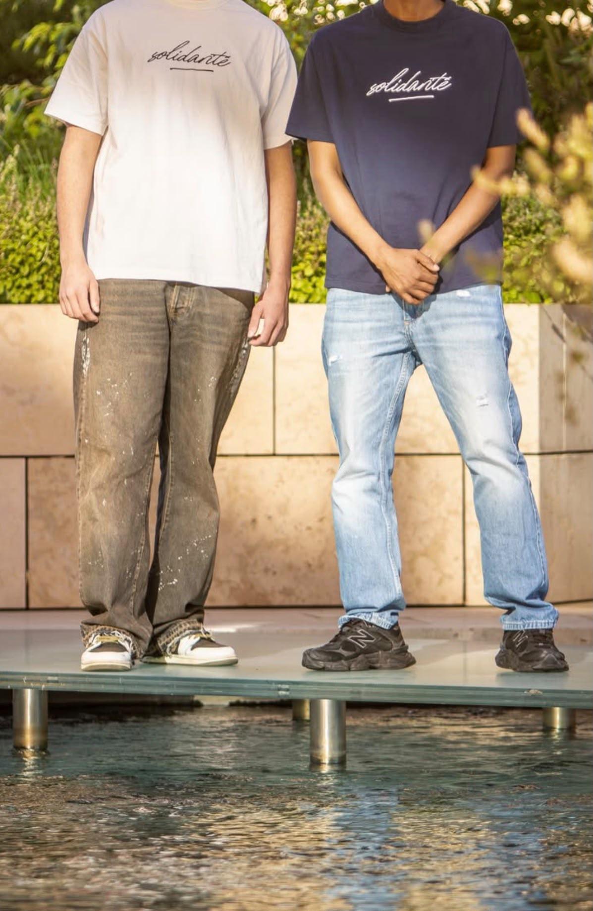 Models wearing Solidarite Official clothing during a brand shoot.